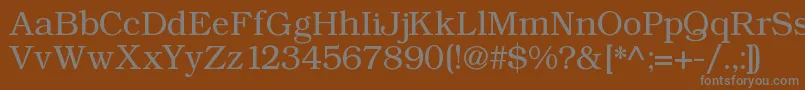 Angltrr-fontti – harmaat kirjasimet ruskealla taustalla
