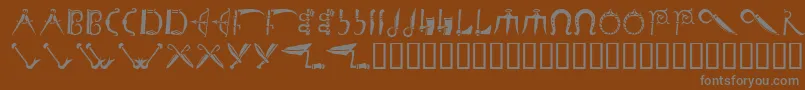 Шрифт Debalmeinitials – серые шрифты на коричневом фоне
