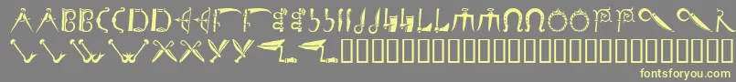 Debalmeinitials Font – Yellow Fonts on Gray Background