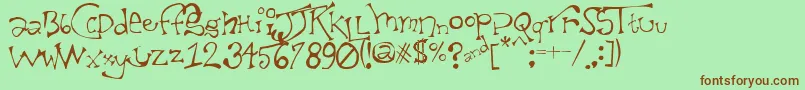 TaxidermistIi-Schriftart – Braune Schriften auf grünem Hintergrund