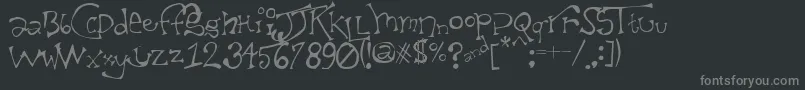 フォントTaxidermistIi – 黒い背景に灰色の文字