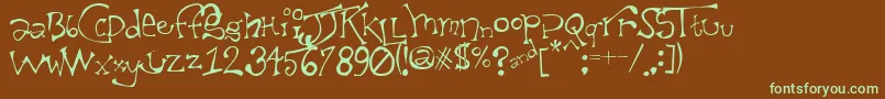 フォントTaxidermistIi – 緑色の文字が茶色の背景にあります。
