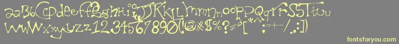 TaxidermistIi-Schriftart – Gelbe Schriften auf grauem Hintergrund
