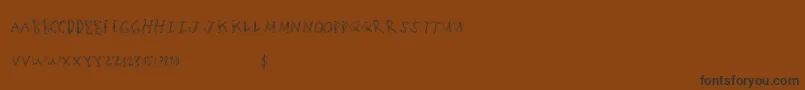 Шрифт Scratchingmatters – чёрные шрифты на коричневом фоне