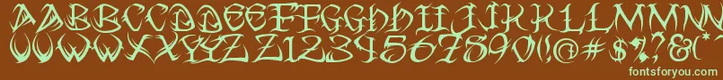 フォントTribal ffy – 緑色の文字が茶色の背景にあります。