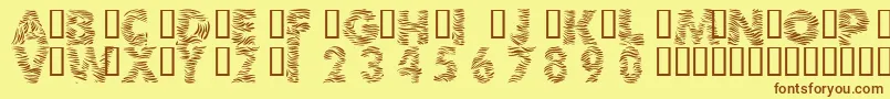 フォント101ZebraPrint – 茶色の文字が黄色の背景にあります。