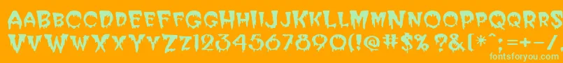 BloodCyrillic-Schriftart – Grüne Schriften auf orangefarbenem Hintergrund