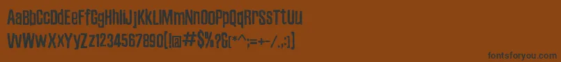 フォントZubajdaDt – 黒い文字が茶色の背景にあります