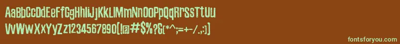 フォントZubajdaDt – 緑色の文字が茶色の背景にあります。