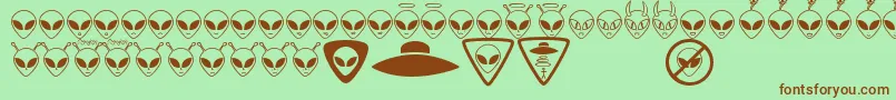 フォントAlienconsTfb – 緑の背景に茶色のフォント