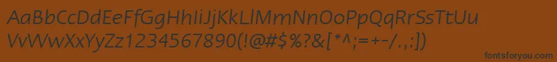 フォントLinotypeErgoItalic – 黒い文字が茶色の背景にあります