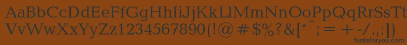 フォントBalticac – 黒い文字が茶色の背景にあります