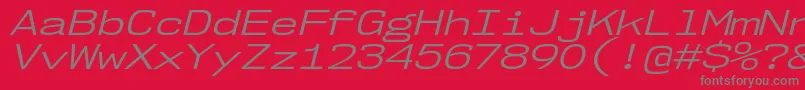 Nk57MonospaceExBkIt-fontti – harmaat kirjasimet punaisella taustalla