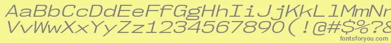 Czcionka Nk57MonospaceExBkIt – szare czcionki na żółtym tle