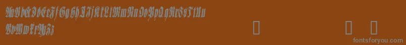 フォントSepud – 茶色の背景に灰色の文字