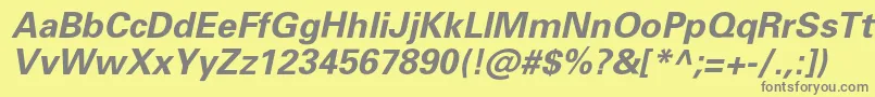 PartnerBolditalic-fontti – harmaat kirjasimet keltaisella taustalla