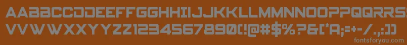 フォントSpyagencyv3cond – 茶色の背景に灰色の文字