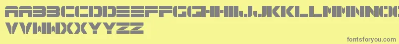 フォントSpac3TechFreePromo – 黄色の背景に灰色の文字