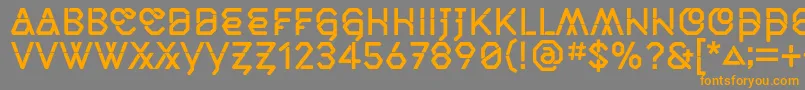 フォントMiddlecaseNextSolid – オレンジの文字は灰色の背景にあります。