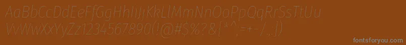 FirasanscondensedHairitalic-Schriftart – Graue Schriften auf braunem Hintergrund