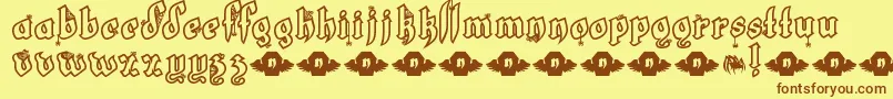 フォントLtWhiteFang – 茶色の文字が黄色の背景にあります。