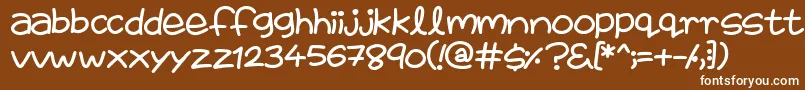 FairiesAreReal-fontti – valkoiset fontit ruskealla taustalla