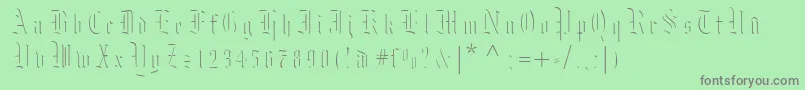 フォントMoksl – 緑の背景に灰色の文字