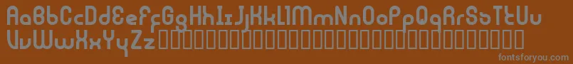 JouluFonttiFenotype-Schriftart – Graue Schriften auf braunem Hintergrund
