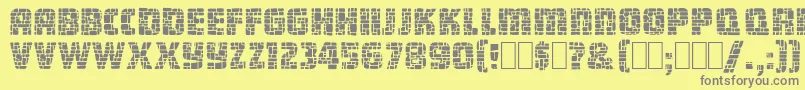 DungeonBlocksFilled-Schriftart – Graue Schriften auf gelbem Hintergrund