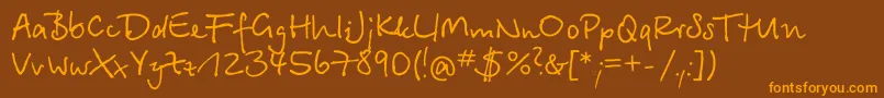 フォントBetinascriptcttRegular – オレンジ色の文字が茶色の背景にあります。