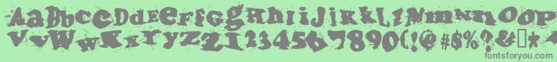 フォントIncantationtwo – 緑の背景に灰色の文字