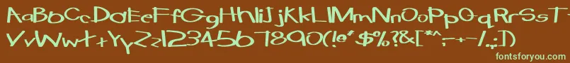 フォントTabathaExBold – 緑色の文字が茶色の背景にあります。
