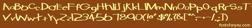 TabathaExBold-fontti – keltaiset fontit ruskealla taustalla