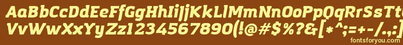 AmazingGroteskUltraItalic-fontti – keltaiset fontit ruskealla taustalla