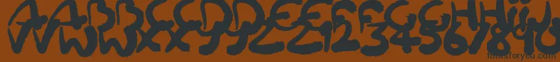 Squiggler Font – Black Fonts on Brown Background