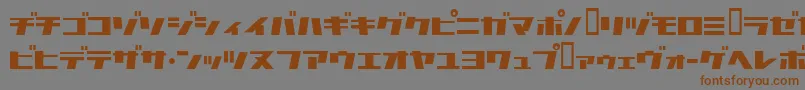 フォントCommercialbreak – 茶色の文字が灰色の背景にあります。