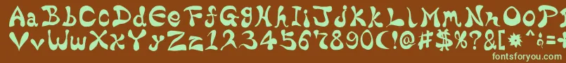 フォントBharaticFontV15 – 緑色の文字が茶色の背景にあります。
