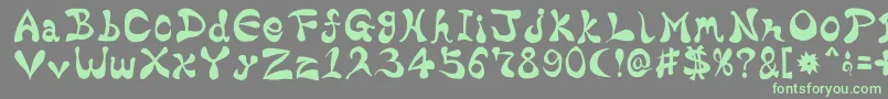 フォントBharaticFontV15 – 灰色の背景に緑のフォント