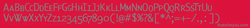 フォントBerlinsmallcaps – 赤い背景に灰色の文字