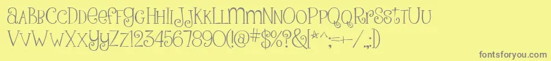 フォントPinkLadiesAndPeanutbutterRegular – 黄色の背景に灰色の文字