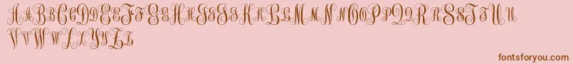 MonogramKkSc-Schriftart – Braune Schriften auf rosa Hintergrund