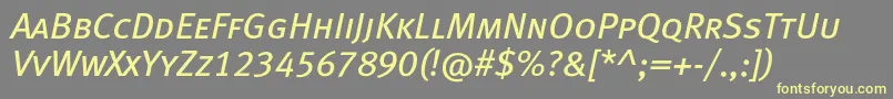 MetabookcapslfcItalic-fontti – keltaiset fontit harmaalla taustalla