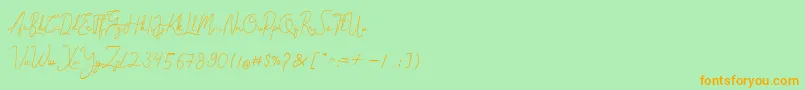 フォントCantilena – オレンジの文字が緑の背景にあります。
