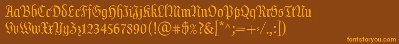 フォントDalaLtText – オレンジ色の文字が茶色の背景にあります。