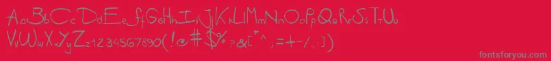 Antipirinahandscript-fontti – harmaat kirjasimet punaisella taustalla