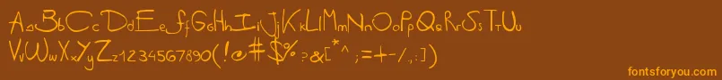 Antipirinahandscript-fontti – oranssit fontit ruskealla taustalla