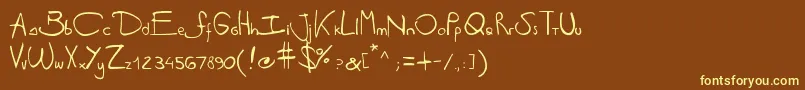Antipirinahandscript-fontti – keltaiset fontit ruskealla taustalla