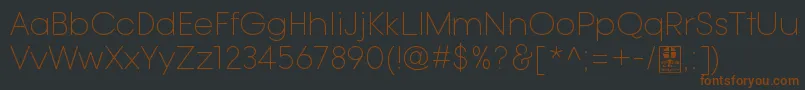 TypoGotikaLightDemo-fontti – ruskeat fontit mustalla taustalla
