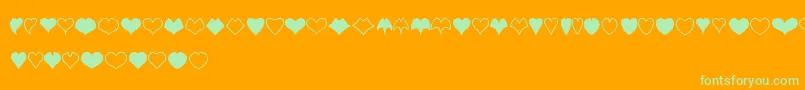 HeartShapes-Schriftart – Grüne Schriften auf orangefarbenem Hintergrund