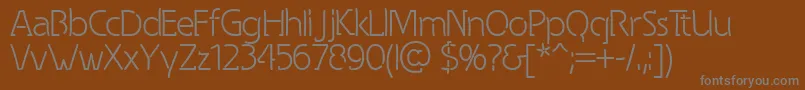 Spongy-Schriftart – Graue Schriften auf braunem Hintergrund